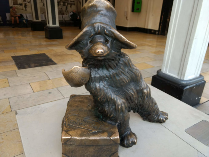 a bronze Paddington bear in Paddington station